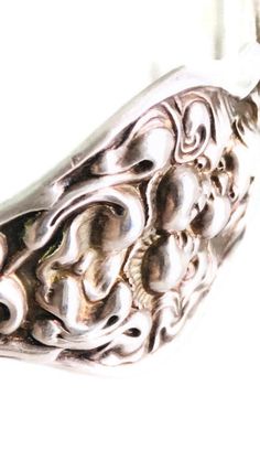 "Exceptional and beautiful piece of Art Nouveau jewelry from the early 1900's. This Unger Brothers cuff bracelet is rendered in sterling silver featuring a beautiful Art Nouveau maiden and floral design on either side of an engraved oval. This piece has been monogrammed with three stylized initials. The underside of the oval has the Unger Brothers hallmarking. This rare piece is in excellent condition with some light marks and nicks to the engraved oval. Measures approximately 5 3/4\" around, no Heirloom Silver Cuff Bracelet For Weddings, Victorian Hallmarked Silver Cuff Bracelet, Victorian Silver Hallmarked Cuff Bracelet, Ornate Engraved Cuff Bracelet For Anniversary, Victorian Style Silver Engraved Cuff Bracelet, Victorian Style Engraved Silver Cuff Bracelet, Silver Victorian Engraved Cuff Bracelet, Silver Hallmarked Heirloom Bangle, Heirloom Silver Hallmarked Bangle