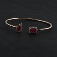 Ruby Bracelet, 18k/14Kt Gold Ruby Bangle, July Birthstone Bracelet, Halo Open Bangle, Open Cuff Bracelet,Ruby Bezel Bracelet,Flexible Bangle Details :- Item Code:- SEB-6021B Gross Weight :- 5.89 gm 18k White Gold Weight :- 5.42 gm Diamond Weight :- 0.36 ct. (Si Clarity Hi Color Certified Diamonds) Ruby Weight :-1.97 ct. Size : 5.62 X 8.06 mm ≫ FAQ below for more detail. ✦ Sizing We can adjust most items to fit your sizing preferences. Most items can be made to any size and length. Please leave a Luxury Gemstone Cuff Bracelet For Anniversary, Formal Gemstone Cuff Bracelet In Bangle Shape, Formal Gemstone Bangle Cuff Bracelet, Fine Jewelry Gemstone Cuff Bracelet For Formal Occasions, Formal Fine Jewelry Cuff Bracelet With Gemstone, Formal Gemstone Cuff Bracelet, Ruby Bangles, Gold Bracelet Simple, Bezel Bracelet