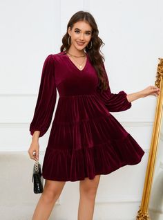 Light up your wardrobe with this charming burgundy velvet dress, designed to make you feel both elegant and comfortable. The dress features a flattering V-neckline and voluminous long sleeves, adding a touch of classic romance to its modern silhouette. The tiered skirt creates a playful yet sophisticated look, perfect for both casual outings and more formal events. Made from luxurious velvet fabric, this dress ensures you stay warm and stylish throughout the season. Pair it with ankle boots for a chic daytime look or with heels and statement jewelry for an evening out. This dress is a versatile addition to your wardrobe, offering endless styling possibilities and ensuring you look your best on any occasion. Burgundy Velvet Dress, Pleated Party Dress, Velvet Party Dress, Classic Romance, Backless Evening Dress, Sequined Dress, Lantern Sleeve Dress, Burgundy Velvet, Evening Sky