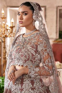 Pakistani Wedding Dress in Traditional Net Maxi Style is a stunning attire adorned with hand-crafted embellishments. Lavish designs and fine details of embroidery give a traditional touch to this perfectly stitched Pishwas Dress, making it an epitome of beauty and grace. Pakistani Maxi: The Pakistani Maxi in a premium quality net fabric is emblazoned with embroidery, motifs, and stones. Intricate design and fine details give a glamorous touch to this beautiful Pakistani Wedding Dress. Stones, th Anarkali Style Embellished Wedding Dress For Eid, Anarkali Hand Embellished Organza Wedding Dress, Festive Hand Embellished Wedding Dress, Elegant Lehenga With Intricate Embroidery For Ceremony, Elegant Ceremony Lehenga With Intricate Embroidery, Festive Anarkali Embellished Wedding Dress, Eid Wedding Dress Hand Embellished Semi-stitched, Festive Embellished Anarkali Wedding Dress, Bollywood Style Embellished Ceremony Dress