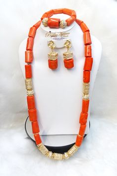 Celebrant Beautiful Real Traditional Coral African Necklace Jewellery Set Complete Set is Necklace earring  and bracelet Wedding Party Bridal Special Occasion This detailed Jewellery set makes you stand out elegantly in any special occassion, it's all about glamour and uniqueness.  Buying more that 1 Jewellery set, we offer wholesale and bulk prices for all our jewellery. Traditional Single Strand Jewelry For Wedding, Elegant Orange Gold Plated Jewelry, Elegant Orange Gold-plated Jewelry, Gold Plated Round Beads Jewelry For Formal Events, Gold Plated Round Beads Jewelry For Formal Occasions, Traditional Orange Single Strand Jewelry, Gold Plated Jewelry With Round Beads For Formal Occasions, Formal Gold Plated Jewelry With Round Beads, Formal Gold Plated Jewelry