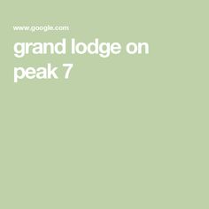 a green background with the words grand lodge on peak 7