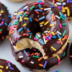 chocolate frosted donuts with sprinkles on them