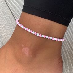 🌸 White and baby pink miracle bead anklet 🌸  ♥️Catches the light to give off a glow!  ♥️Perfect for nights out or even holidays!  ♥️Please message me if you have any questions each  ♥️ All anklets are made on rope. The two ends will need to be tied together and in a double knot so that the anklet does not come off. These are safe to wear in water.  Also available with matching bracelets, earrings and chokers! The colour may vary slightly due to most images being taken under direct sunlight or with flash to show you the full effect of the beads x  White beads may appear grey/silver when opened in a dark room. The full effect of the beads will shine through in different lights. Please note: Buyer pays for any return postage/ exchange postage x Cheap Pink Round Bead Anklets, Casual Pink Anklets For Summer, Casual Pink Anklet For Summer, Adjustable Pink Anklet With Colorful Beads, Pink Tiny Beads Anklets For Summer, Pink Beaded Anklets For Summer, Pink Anklets With Tiny Beads For Summer, Pink Beaded Summer Anklets, Summer Pink Anklet With Colorful Beads