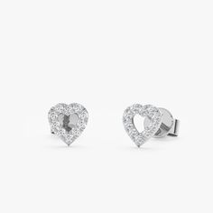 Penelope Add a touch of romance with these delicate Heart Outline Diamond Studs. Crafted from solid gold (available in yellow, white, or rose gold), they feature a classic heart design outlined with sparkling diamonds. Perfect for everyday wear or special occasions, these versatile earrings can be dressed up or down. They make a perfect gift for a loved one or a special treat for yourself. - Handmade- Solid Gold- Natural Diamonds - G Color, SI Quality Diamonds- Total Diamond Carat Weight: 0.20 c Elegant White Heart Earrings For Anniversary, Elegant Diamond White Heart Earrings For Valentine's Day, Elegant Diamond White Heart Cut Earrings, Classic Open Heart White Gold Jewelry, Classic White Gold Heart Earrings With Diamond Cut, Classic Sterling Silver Heart Earrings With Brilliant Cut, White Gold Double Heart Fine Earrings, White Gold Double Heart Fine Jewelry Earrings, Classic White Gold Diamond Cut Heart Earrings