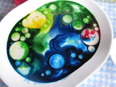 a white bowl filled with liquid and bubbles