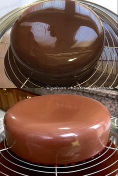 a chocolate cake sitting on top of a metal rack next to a plate with a piece of cake in it