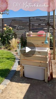 an outdoor kitchen made out of pallets and wood with the words diy matchbox on it