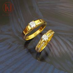 two gold wedding rings with diamonds on them