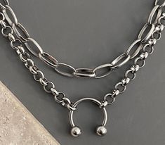 PLEASE READ ITEM DETAILS/DESCRIPTION: 🟦CHAIN:  -stainless steel (NON-TARNISH, long-lasting) ✔️TWO SEPARATE NECKLACES -14 inch and 16 inch, OR -16 inch and 18 inch (women's AVERAGE neck size), OR -18 inch and 20 inch, OR -20 inch and 22 inch  -see Sizing Chart photo -lobster claw clasps 🟦PENDANT(S):  *silver plated base metal -tarnish resistant coating 🔵CARE INSTRUCTIONS: To maintain the color and shine of our fashion jewelry: avoid contact with beauty/body products and water/perspiration; cle Necklaces Layered, Bull Ring, Metal Pendants, Silver Plated Jewelry, Punk Goth, Beauty Body, Metal Pendant, Body Products, Rock Style