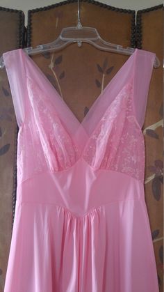 "70s gorgeous bubblegum pink nylon maxi slip / nightie by Vanity fair. The bust has delicate embroidered flower detail. Waist is accentuated with a deep V and a maxi length skirt part. Sheer hem and shoulder straps. **just very light 'scratch' marks on bottom of skirt but barely visible** Size 36 Nylon Length 55\", waist 28\" Made by vanity fair" Pink Sheer Sleeveless Nightgown, Feminine Pink V-neck Nightgown, Vintage Pink Sleeveless Nightgown, Pink V-neck Nightgown With Lace Trim, Womens Lingerie, Vintage Pink V-neck Nightgown, Neon Coral, Flower Detail, Pink Suede