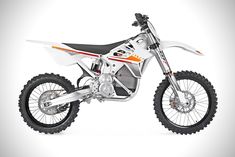 an orange and white dirt bike on a white background