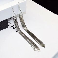 Chain fringe earrings that will surely make a statement all on their own!  Hypoallergenic color: gold material: 14k gold fill size: 5" in length Long Silver Earrings, Chain Fringe, Long Tassel Earrings, Earring Sale, Shoes With Jeans, Fringe Earrings, Tassel Earrings, Gold Material, Earring Necklace