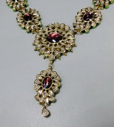 "Vintage 22K solid gold, Old cut Diamonds set with multicolor Enamel work necklace (Kundan Meena choker)with Matching Earrings. A nice old design from the 60s with old cut diamonds. A solid piece of jewelry set with color stones great workmanship. Length of necklace -28 cm (11.02\") Size could be adjusted according to your requirement by adding an adjustable cord. The width of Centerpiece-7 cm (2.75\"), the total weight of set -100.860 Grams (3.55 ounce). Length of earrings-6.5 cm,width of earri Traditional Jeweled Kundan Necklace For Ceremonial Occasions, Traditional Jeweled Kundan Necklace For Festivals, Traditional Jeweled Kundan Necklace For Diwali, Diwali Kundan Necklace With 17 Jewels, Kundan Necklace With 17 Jewels, Ornate Hand Set Kundan Necklace For Ceremonial Occasions, Traditional Jeweled Temple Necklace For Diwali, Ornate Jeweled Necklaces For Festivals, Traditional Kundan Necklace With 17 Jewels For Diwali