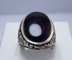 Natural Black Blood Red Yemeni Aqeeq Ring With Beautiful Polished Beautiful Handmade Ring Design 925 Sterling Silver We Happily Provide our Customers '100% Natural Gemstones, 925 Sterling Silver and Magnificent Ring Designs'.We always provide BEST quality material. So Don't miss and Choose the Best. WHY US? * 100% Natural Stones * 925k Sterling Silver * Your satisfaction is very important to us * We are giving you %100 satisfaction guarantee * Returns are accepted under some conditions. * If you Traditional Black Sterling Silver Rings, Traditional Black Ring Jewelry, Traditional Black Rings As Gifts, Traditional Black Ring For Gift, Traditional Black Rings For Gift, Traditional Black Rings For Formal Occasions, Black Onyx Ring Men, Bishop Ring, Gifts For Engagement