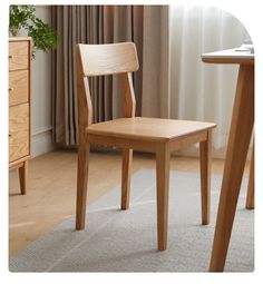 a wooden chair sitting in front of a table