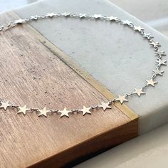 "Boho Beach Star Choker... ~available in tarnish resistant 14kt gold/silver  plated metal, or 14kt gold filled (not plated) ~adjustable length 14-16\" (custom length available upon request) ~Specially packaged and ready for gift giving Please visit my shop for more great jewelry finds: ChrisKateJewelry.etsy.com Current Processing Times All of my items are lovingly handcrafted and made-to-order so please be sure to view my shop announcement on my shop's main page for the most up-to-date processing time.  Please note that processing time does NOT include shipping time. Expedited Shipping  For domestic customers you will have the option to select upgraded shipping during the checkout process; please understand that the current processing time still applies.  However, I do my very best to ship Star Choker, Leather Corded Necklace, Sterling Silver Cross, Macrame Bracelets, Main Page, Cord Necklace, Boho Beach, Silver Cross, 14kt Gold