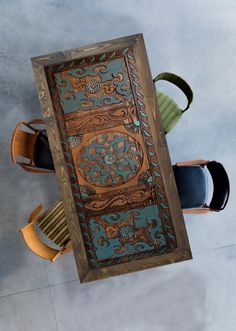 an overhead view of a table with chairs and a wooden door on the wall above it