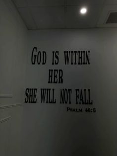 a wall with the words god is within her she will not fall