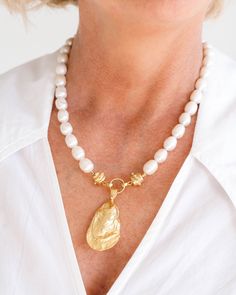 Pearls and oysters are a natural pair and a staple among our collections. With detailed texture, the perfect oyster pendants hangs from a strand of genuine freshwater pearls. Oyster Necklace, Pearl Necklace Designs, Oyster Pearl, 24kt Gold, Hair Accessories Jewelry, Oyster Shell, Freshwater Pearl Necklaces, Short Necklace, Gold Style