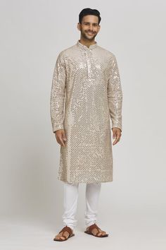 Ivory and gold cotton kurta with sequins and thread embroidery. Comes with churidar. - Aza Fashions Unstitched Traditional Wear With Sequins For Eid, Unstitched Sequined Traditional Wear For Eid, Gold Sherwani With Mirror Work For Diwali, Festive Gold Sherwani With Gota Work, Semi-stitched Kurta With Gold Embroidery For Festivals, Eid Gold Kurta With Resham Embroidery, Festive Gold Embroidered Sherwani For Diwali, Designer Chanderi Sequin Kurta, Designer Gold Sherwani With Gota Work