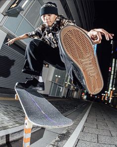 a skateboarder doing a trick in the air with his shoe on their board