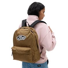 The Vans Realm Backpack is a two pocket backpack with debossed lining at the interior back panel. It has a zippered main compartment, a front organization pocket for storing items neatly and an interior laptop sleeve. It measures 42,5 H x 32,4 W x 12 D cm and has a 22-litre capacity. It has the Vans Off The Wall branding on the front. LAPTOP SLEEVE - Keep your laptop safe in a padded internal laptop sleeve. Fits most full-sized laptops. ORGANISATION - Arrange your cords, pens, and other importan Classic School Backpack With Pockets, Vans Bags For Students Back To School, Vans Bags For Back To School, Vans Functional Backpack For Back To School, Functional Vans Backpack, Casual Vans Bag For Students, Functional Vans Backpack For Back To School, Casual Vans Backpack For Students, Casual Vans Backpack For Everyday Use