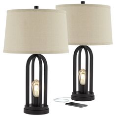 two lamps are next to each other on a white background