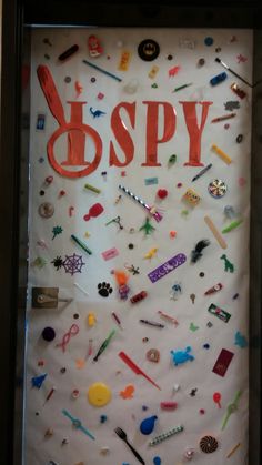 a display case filled with lots of different types of buttons and magnets on white paper