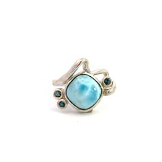 A freeform sterling silver ring. Bezel set in the center is a cabochon ocean blue larimar with bezel set round blue topaz accents. This ring is a size 8.  This ring cannot be sized up or down by our goldsmith. Stone Information Type: Larimar Measurements: 10x10mm Type: Blue Topaz Measurements: 2.3mm (3) Metal Content Guaranteed Sterling Silver Weight: 7.16 grams Measurements of Ring 1/16 inches wide (17mm) 1/4 inches off finger (7mm) 2.2mm wide shank at bottom Markings "925" Blue Larimar Cabochon Rings, Ring Bezel, May 2023, Topaz Ring, Ocean Blue, Ring Sterling Silver, Sterling Ring, Bezel Setting, Blue Ocean