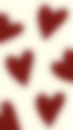 red and white hearts are arranged in the shape of an abstract pattern on a white background