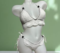 Turn heads and radiate confidence in this exclusive crochet bikini set. Handcrafted for a look as unique as you are! This bikini is crafted from a luxurious 50% cotton and 50% acrylic blend, offering both the natural breathability of cotton & the soft, comfortable feel of acrylic. Perfect for soaking up the sun in comfort!  ---------CARE-------- For the gentlest care, hand wash it with cool water only and lay it flat to dry. Alternatively, you can machine wash on a gentle cycle with cool water, White Crochet Swimwear For Pool, Handmade White Swimwear For Poolside, Handmade White Summer Swimwear, White Handmade Summer Swimwear, Handmade White Swimwear For Summer, Handmade White Swimwear For Beachwear, Handmade White Swimwear For Vacation, Handmade White Swimwear For Beach Season, Handmade White Triangle Top Swimwear