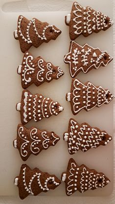 decorated cookies are arranged in the shape of fish