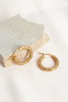 Inspired by embroidered floral blouses. Meet our Molten Meadow Hoops. You have to see these earrings up-close to fully appreciate their intricate beauty. These are real 18k gold-plated, and feature tiny wild flowers.  Light-to-medium weight, so perfect for all-day wearing.  Waterproof, sweat-proof and life proof! All our earrings are made of the highest quality materials and are free from nickel and brass, so won't ever tarnish, rust or turn your skin green! LIGHT CLEANING We recommend gently cl Elegant Textured Gold Plated Hoop Earrings, Elegant Textured Gold Plated Earrings, Elegant Textured Gold-plated Jewelry, Textured Gold-plated Yellow Gold Jewelry, Textured Gold Plated Yellow Gold Jewelry, Textured Yellow Gold-plated Jewelry, Textured Yellow Gold Plated Jewelry, Elegant Textured Brass Jewelry, Elegant Textured Yellow Gold Jewelry