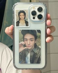 a person holding up a cell phone case with pictures on it