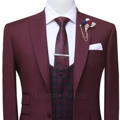 Look your best on any special occasion with a custom burgundy 3 piece suit. Made from premium quality wool suiting fabric and featuring a classic peak lapel, single button front closure, and double flapped pockets, this suit is sure to turn heads. A checkered vest adds a touch of elegance and sophistication, making it the perfect suit for weddings, proms and other formal events. Features: Made from premium quality wool suiting fabric. Classic peak lapel Single button front closure Double flap po Tailored Burgundy Tuxedo For Business, Burgundy Tailored Tuxedo For Business, Tailored Burgundy Business Tuxedo, Fitted Burgundy Tuxedo For Business, Burgundy Fitted Tuxedo For Business, Red Three-piece Suit With Notch Lapel For Groom, Red Notch Lapel Three-piece Suit For Groom, Classic Fitted Burgundy Tuxedo, Classic Burgundy Suits With Suit Collar