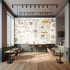 a coffee shop with tables and chairs in front of a large mural on the wall