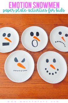 four paper plates with snowmen painted on them and the words emotion written in black