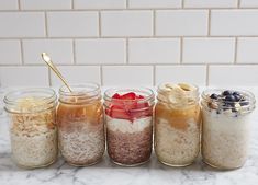 six jars filled with different types of food