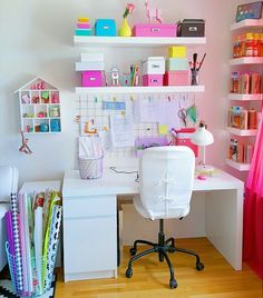 a white desk topped with a computer monitor and lots of shelves filled with office supplies