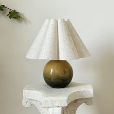 a lamp sitting on top of a white table