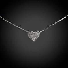 "Handmade sterling silver heart shaped charm with actual fingerprint you submit to us.   The dainty heart charm  is approximately 3/8\"  Select either a 16\" or 18\" sterling silver chain to accompany this pendant. Optional:  18\" 1.4mm flat oval cable chain.  The flat surfaces catch the light in this classic sterling silver oval cable chain, making the white metal even brighter. This is a great chain for small pendants. This chain is plated with fine silver to ensure a bright white color and to Minimalist Engraved Sterling Silver Heart Necklace, Stamped Sterling Silver Heart Pendant Jewelry, Stamped Heart Shaped Sterling Silver Jewelry, Sterling Silver Heart-shaped Stamped Jewelry, Stamped Sterling Silver Heart Jewelry, Sterling Silver Heart Stamped Jewelry, Etched Heart Pendant Necklace For Valentine's Day, Heart-shaped Laser Engraved Sterling Silver Jewelry, Minimalist Sterling Silver Laser Engraved Necklace