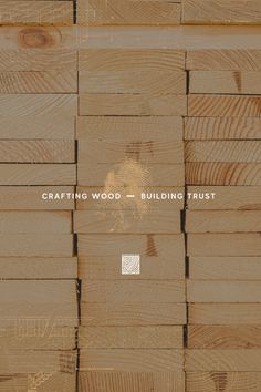 the words crafting wood and building trust are on top of wooden planks that have been stacked together