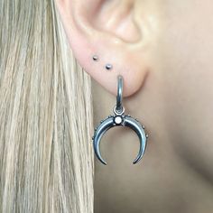 These Crescent Moon earrings are crafted with stainless steel and featuring a shiny black CZ stone, they are sure to make a statement. Sold as pair Material : 316 Stainless steel Hoop inner diameter: 10mm Hoop thickness: 2mm Hoop length:33 mm Post: regular 22 G Charm is removable Ships in a gift box Listing for Moon earrings only Minimalist Surgical Steel Pierced Jewelry, Nickel-free Surgical Steel Hoop Jewelry, Silver Crescent Internally Threaded Cartilage Earrings, Silver Crescent Cartilage Earrings With Internally Threaded, Silver Small Hoop Earrings Surgical Steel, Silver Crescent Single Cartilage Earring, Silver Surgical Steel Hoop Jewelry, Silver Small Hoop Earrings In Surgical Steel, Nickel-free Stainless Steel Hoop Cartilage Earrings