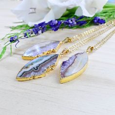 Stone: Amethyst Slice Chain Length: 16-30inch Dimensions: 1.5inches x 1inches (40mm x 25mm) Color: Gold Chain: Gold Stainless Steel Chain SKU: EPJ-N19SBA12 This necklace is made from a natural amethyst slice which has been cut into a marquise shape. The stone is plated with 24k gold on half of the edges and hangs from a gold stainless steel chain. Please choose the length you would like the necklace in. Please choose the chain style you would like your pendant on. All stones are natural. Any irr Purple Necklace With Large Stone For Gift, Purple Spiritual Necklace With Large Pendant, Spiritual Purple Necklace With Large Pendant, Purple Necklace With Large Round Pendant, Amethyst Large Pendant Necklaces For Jewelry Making, Amethyst Large Pendant Jewelry Gift, Amethyst Necklace With Large Pendant For Healing, Spiritual Purple Jewelry With Large Pendant, Purple Pendant Necklace With Large Pendant