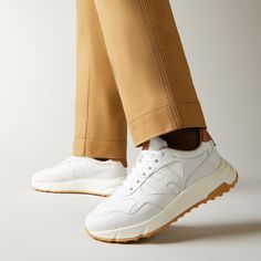 Characterized by smooth and dynamic forms, these men's Hogan Hyperlight sneakers combine the jogging shoe lines and urban features. The nappa leather upper recalls iconic details of the brand and is enhanced by a side H. An ultra dynamic style, with a memory foam insole and a lightweight outsole with spikes inspired by the historic H383 style. Modern Sneakers With Textured Sole For Jogging, Modern Textured Sole Jogging Sneakers, White Leather Running Shoes With Vibram Sole, White Leather Running Shoes With Textured Sole, Modern Calf Leather Sneakers For Sports, Modern Sneakers With Vibram Sole For Jogging, Modern Jogging Sneakers With Vibram Sole, White Leather Running Shoes For Jogging, Dynamic Leather Sneakers With Vibram Sole