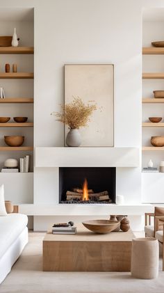 a living room with a fire place in the center