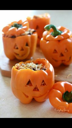 several carved pumpkins with faces on them