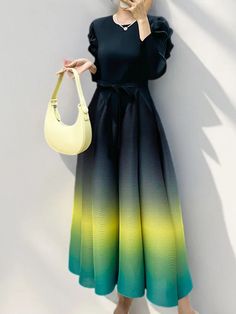 Inspired by the mesmerizing transition of hues seen in a sunset, this ombre pleated dress brings both elegance and whimsy to your wardrobe. Featuring puffy upper sleeves and crafted from authentic Japanese pleated fabric, it offers a loose, comfortable fit that moves with grace. Perfect for both casual outings and special occasions, this limited edition piece radiates modern sophistication and timeless beauty. Why You Need It Ombre Gradient: Stunning color transition. Puffy Sleeves: Adds dramatic flair. Loose Fit: Ensures comfort and movement. Japanese Pleated Fabric: Flows gracefully. Elegant and Modest: Versatile for any occasion. Limited Edition: Secure yours before it’s gone. Size Chart Measurements are in inches. Size Length Sleeve Length Bust Shoulder One Size 53.15 20.47 35.43-48.03 Puffy Sleeve Dress, Color Transition, Ombre Gradient, Pleated Fabric, Puffy Sleeves, New Tops, Sweater Coats, Yellow Dress, Pleated Dress