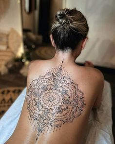 a woman with a tattoo on her back